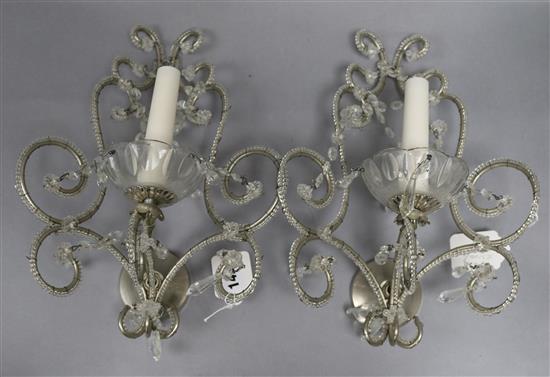 A pair of glass bead and silvered metal two branch wall sconces length 31cm